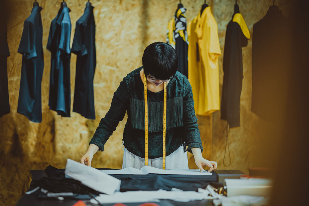 Technical designer working at her desk.